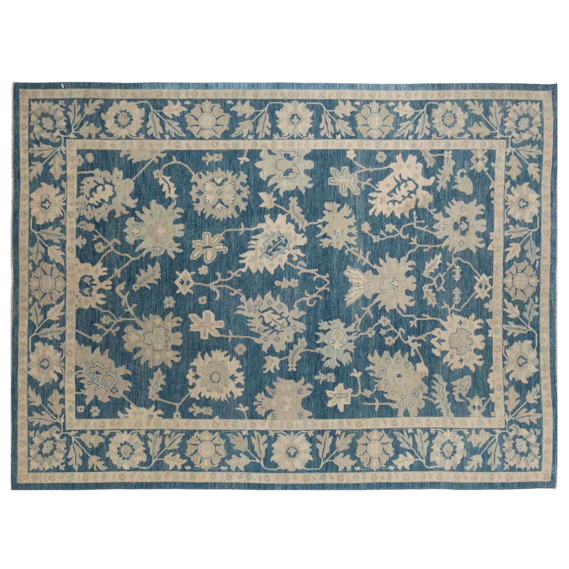 Dark blue 10x14 Oushak area rug with beige floral palmettes and light blue accents.