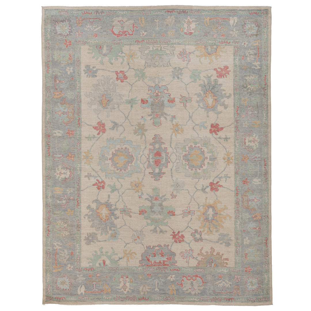 Hand-knotted 9x12 Oushak area rug featuring an ivory center field with rose and light blue geometric floral palmettes.