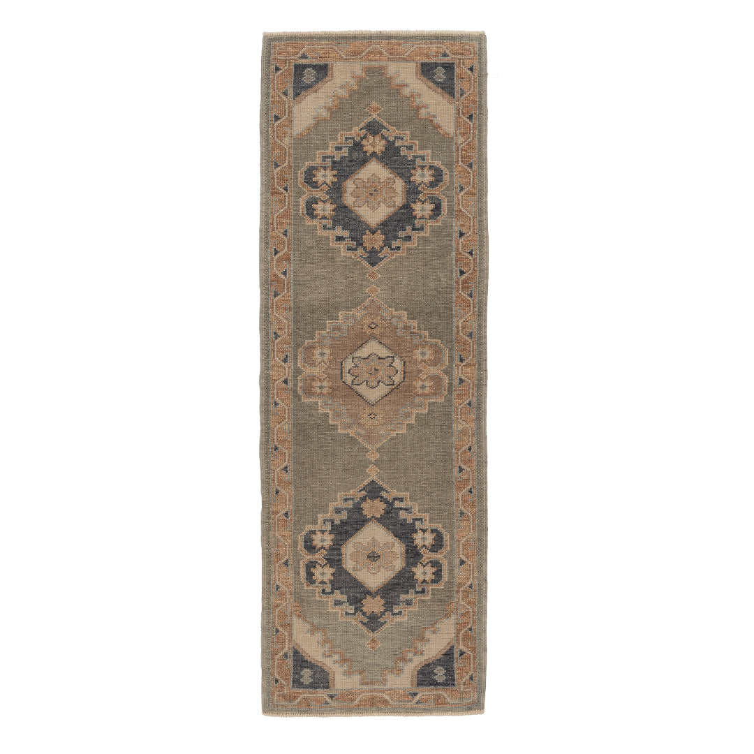 Sage green 2.5x8 Oushak runner rug with three stepped navy and brown diamond medallions framed by a terracotta geometric border.