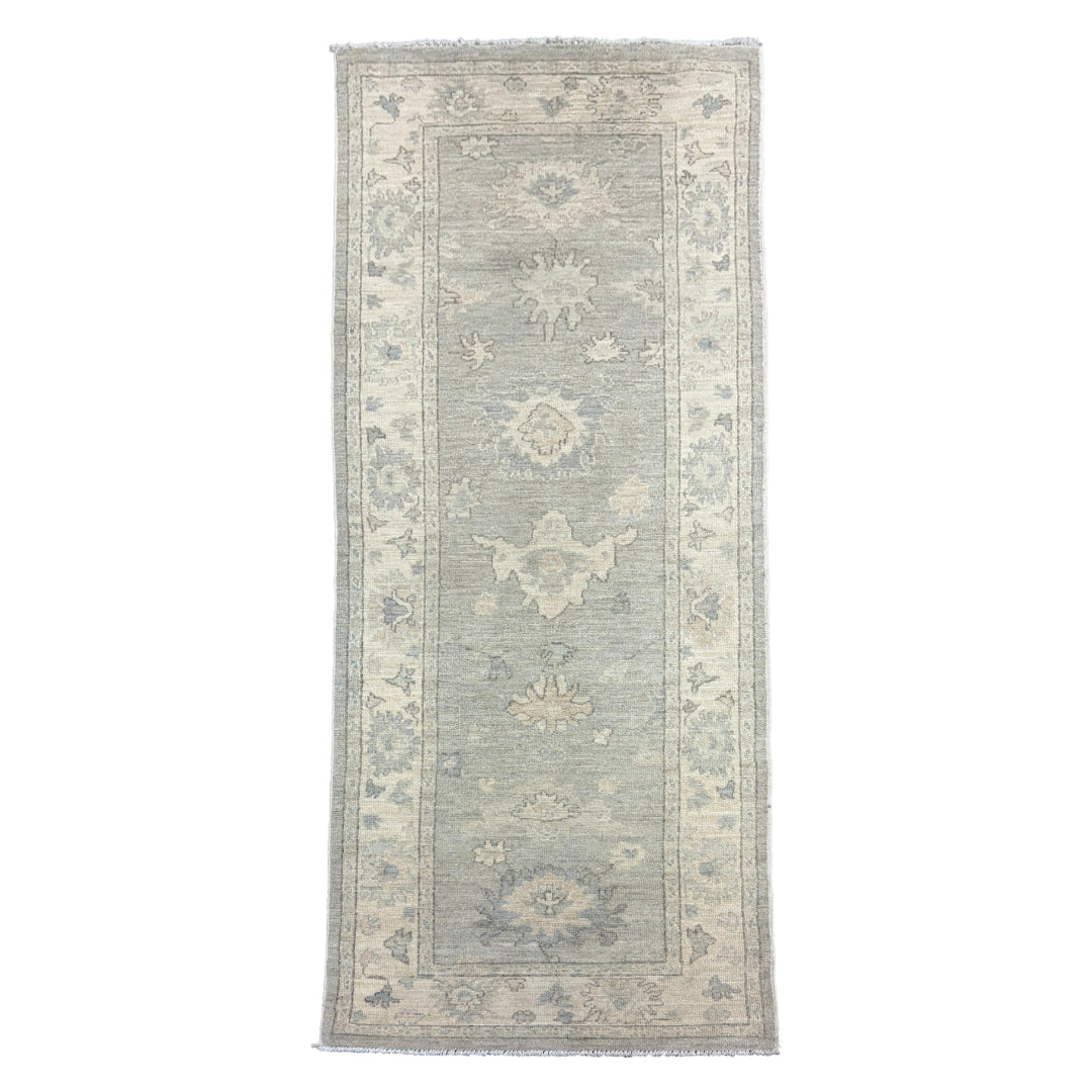 Soft light blue 2.5x8 Oushak runner rug with floating ivory floral medallions and a matching ivory border.
