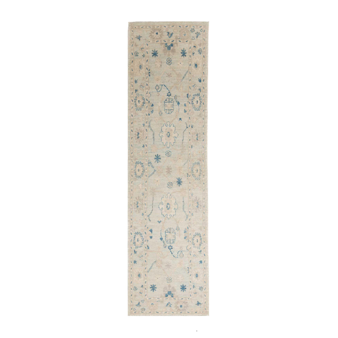 Light blue 100% wool Oushak area rug runner with beige field and dark blue geometric accents.