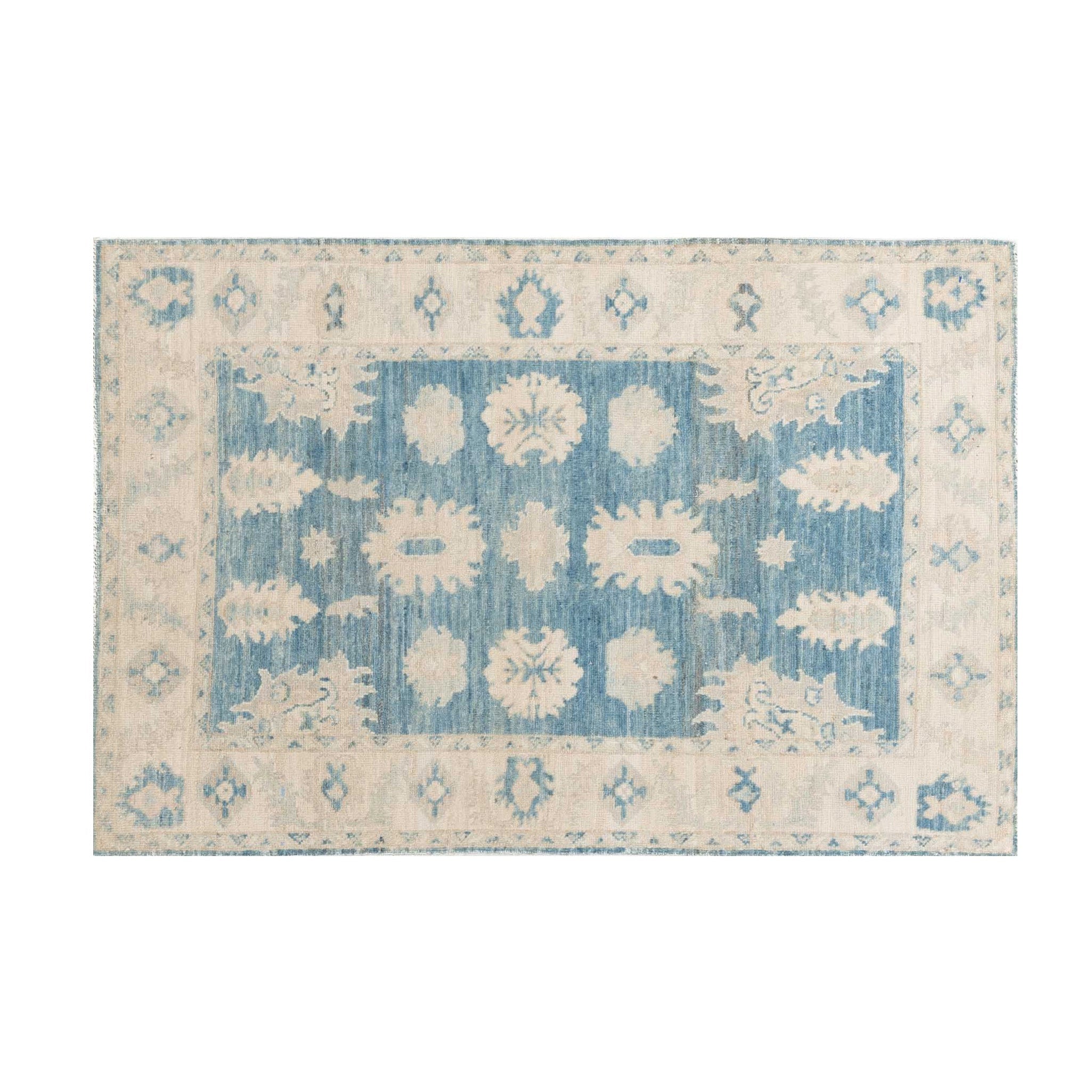 Traditional dark blue 3x5 Oushak area rug with soft ivory and beige geometric medallions and a distressed finish.