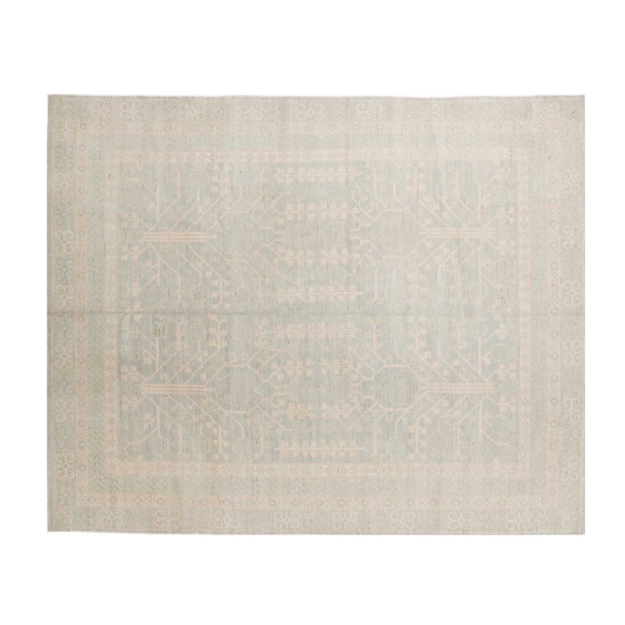 Muted pale blue 8x10 Khotan area rug with cream tree-of-life motifs and a geometric multi-tiered border.