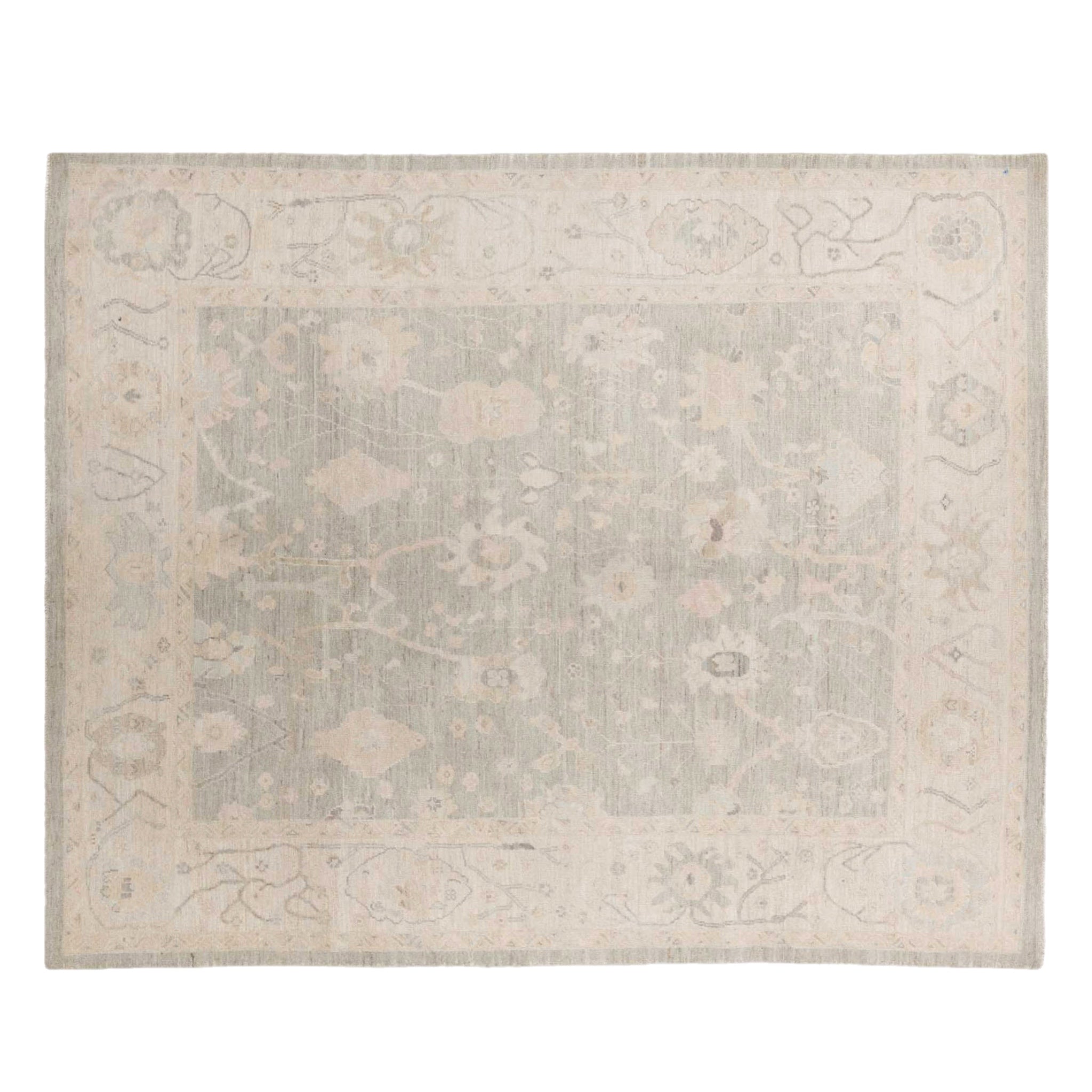 Soft light grey 8x10 Oushak area rug with cream floral medallions and a broad cream border.