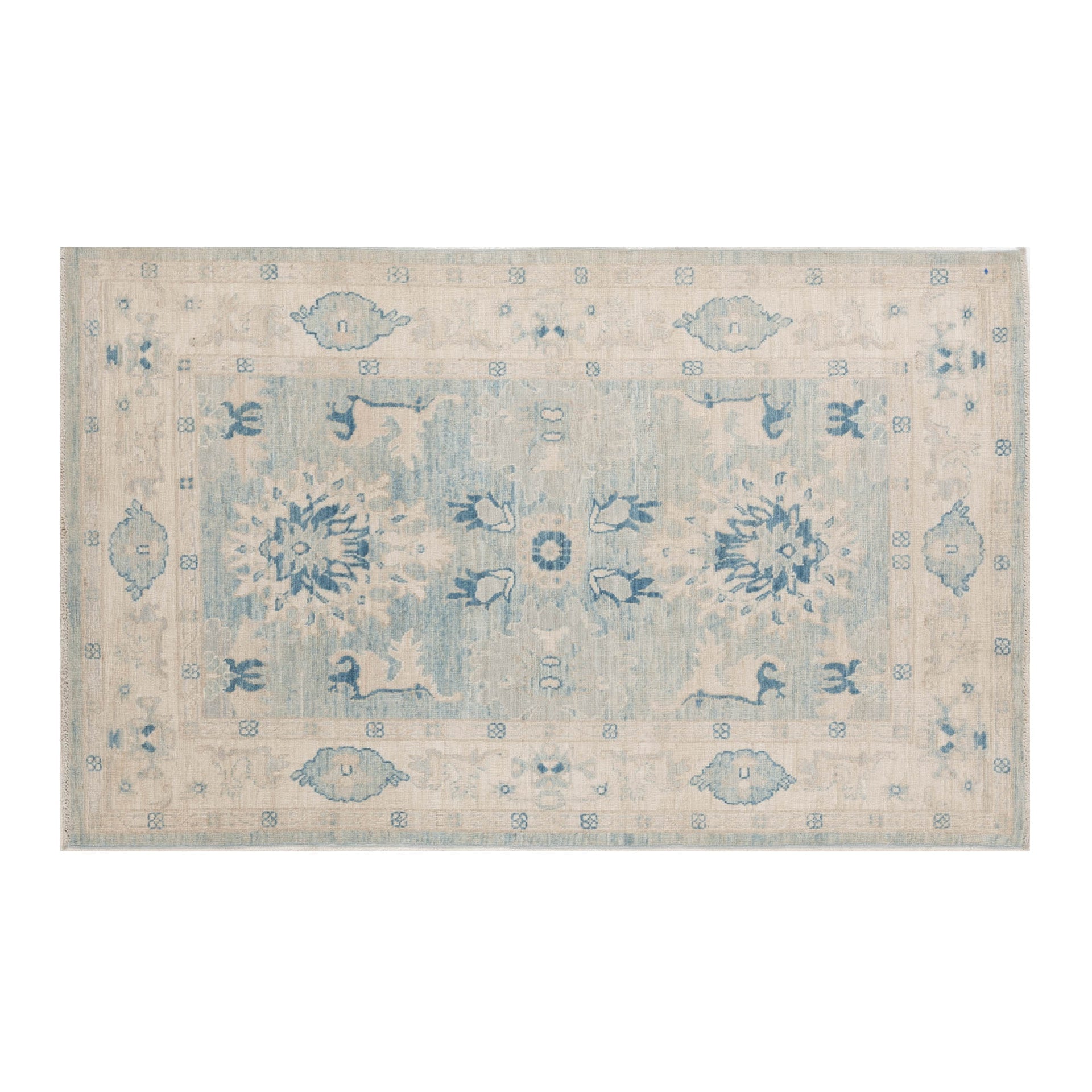 Weathered light blue 4x6 Oushak area rug with large ivory and sand-beige floral medallions, dark blue accents, and a cream border.