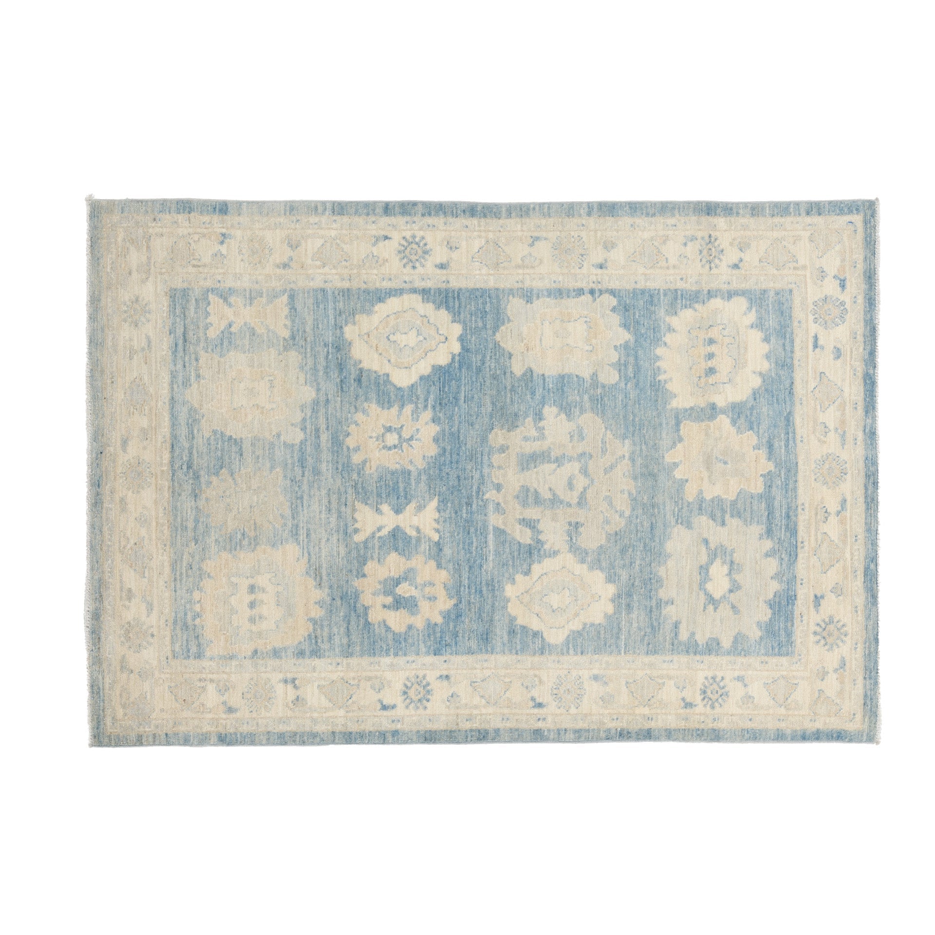 Traditional medium blue 4x6 Oushak area rug with warm beige and ivory geometric medallions and a distressed cream border.