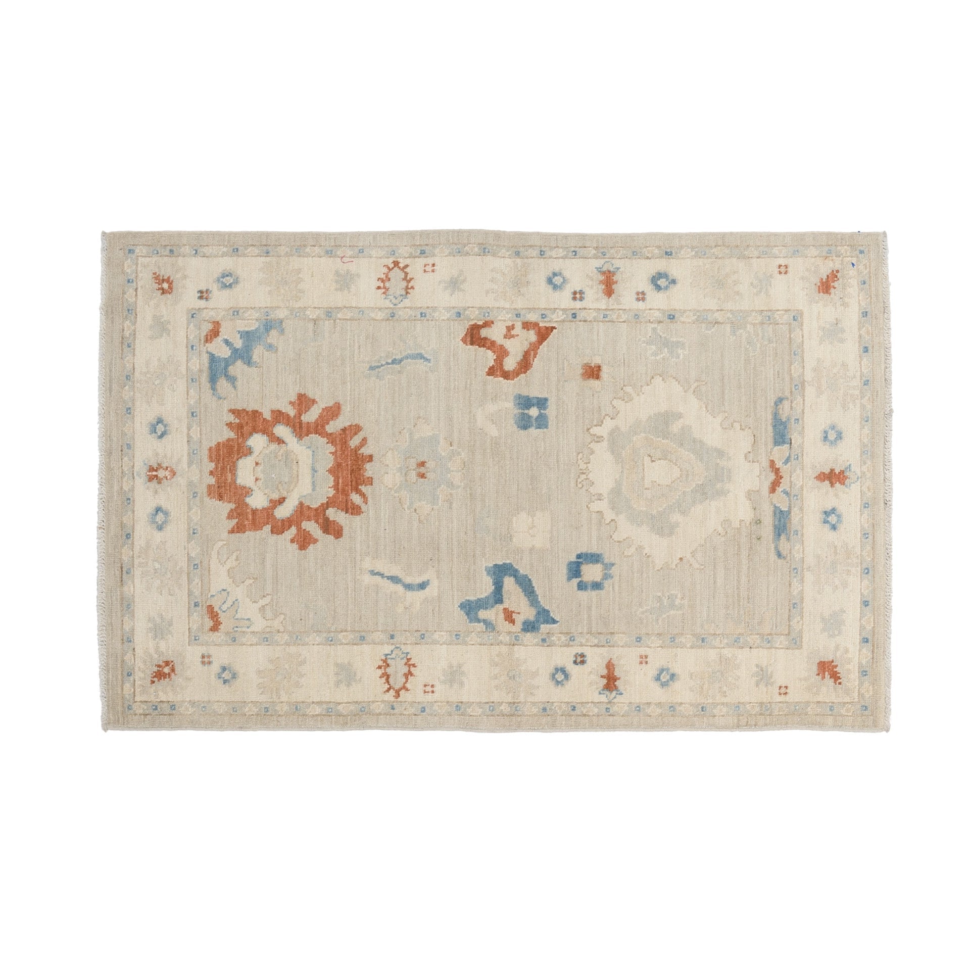 Muted beige 3x5 Oushak area rug with prominent rust and blue geometric floral medallions and a cream border.