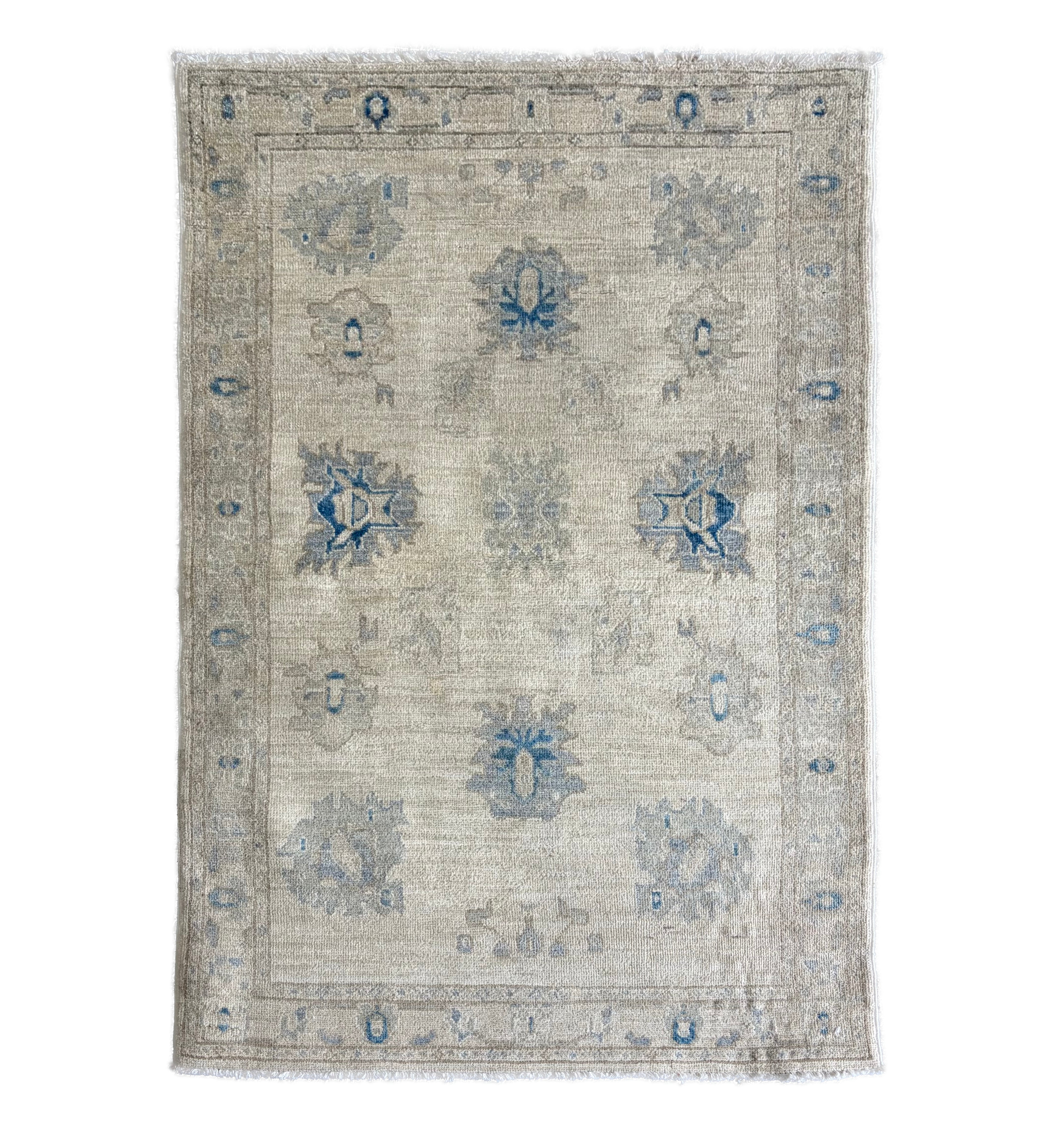 Traditional ivory 3x5 Oushak area rug with muted light blue and prominent dark blue geometric floral motifs.