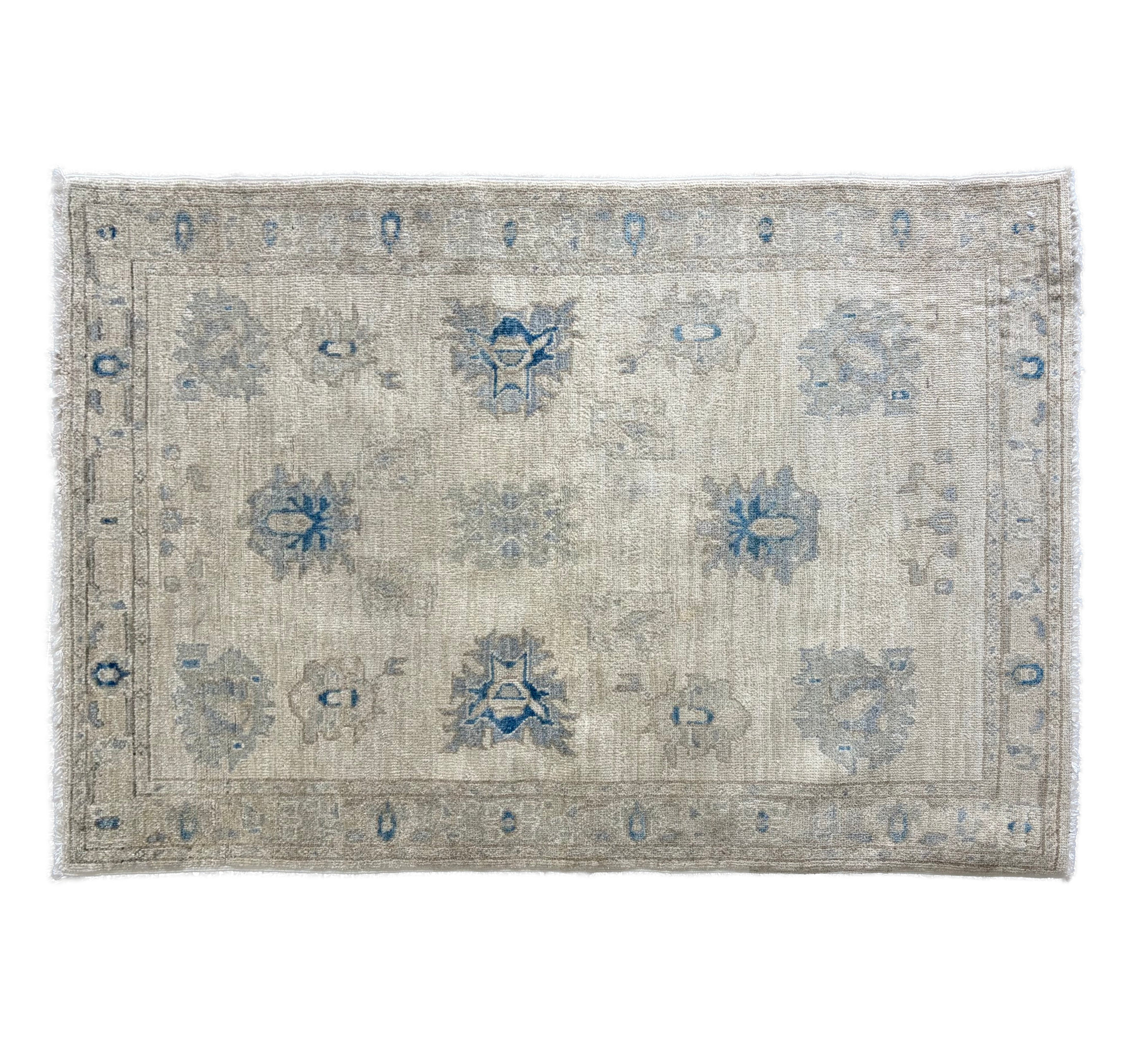Traditional ivory 3x5 Oushak area rug with muted light blue and prominent dark blue geometric floral motifs.