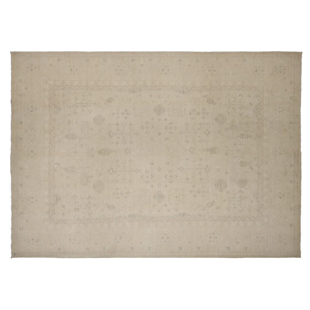Tone-on-tone alabaster 10x14 Oushak area rug with pale linen geometric motifs and soft greige details.