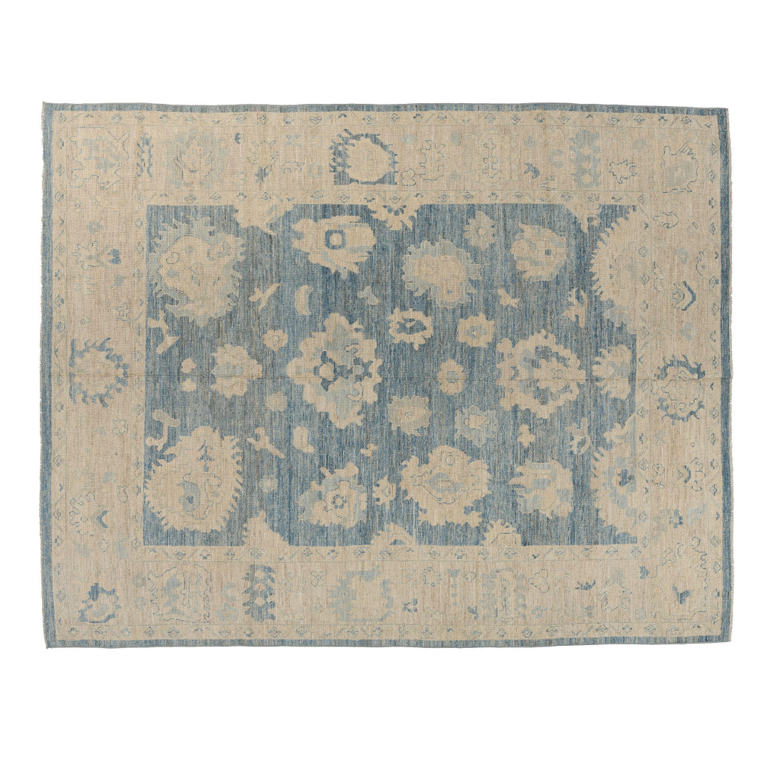 Rich dark blue 9x12 Oushak area rug with beige star cartouches and light blue floral accents.