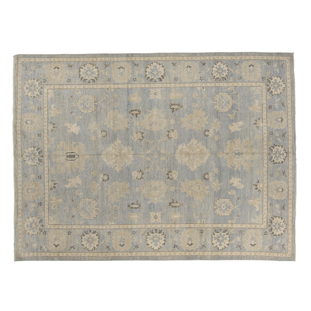 Periwinkle blue 9x12 Oushak area rug with ivory floral star medallions and delicate charcoal geometric accents.