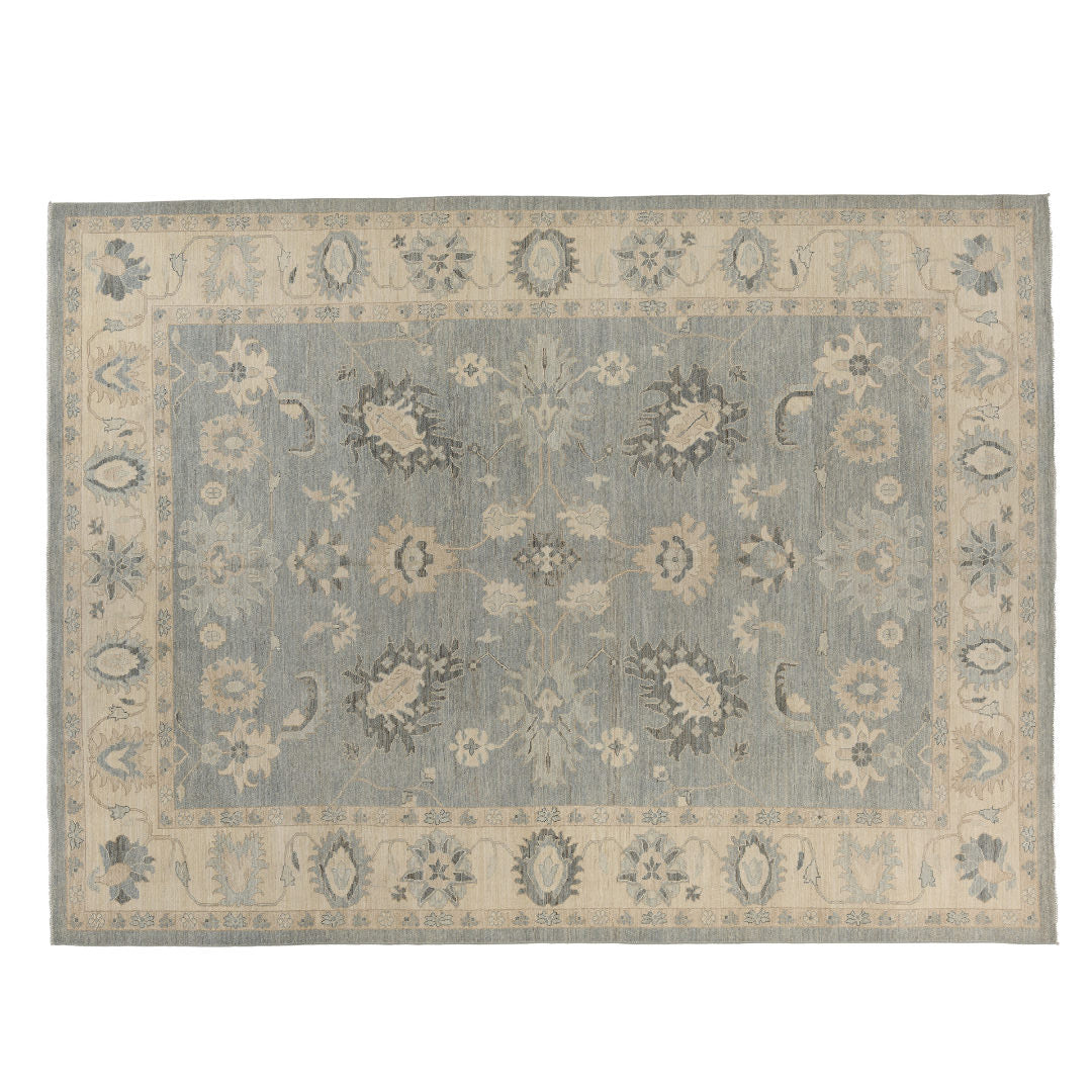 Slate blue 9x12 Oushak area rug with cream floral medallions and charcoal accents framing a cream border.