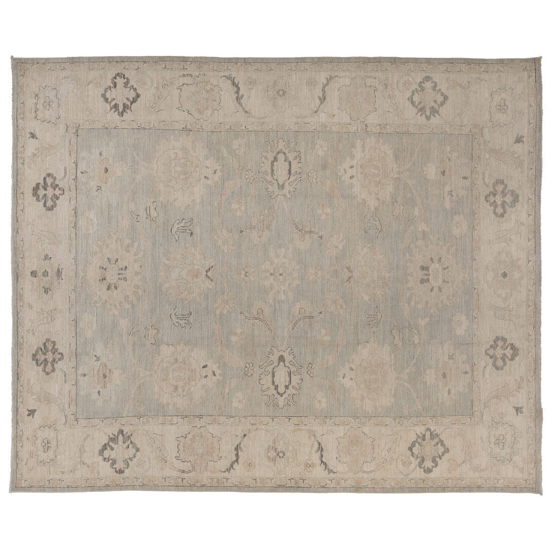 Hand-knotted 9x12 Oushak area rug with a muted grey-blue field, soft ivory details, and a wide ivory-beige border.