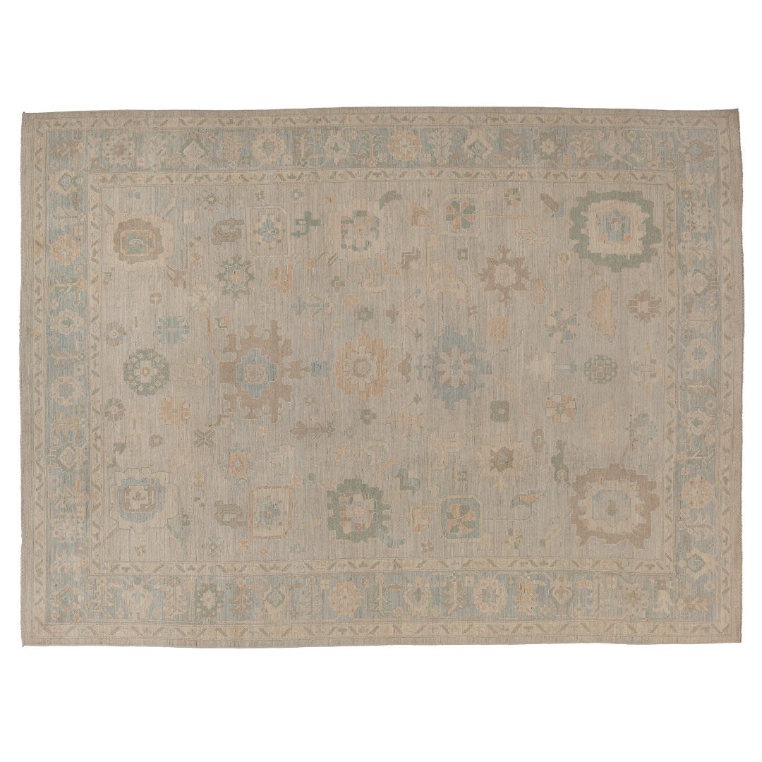 Hand-knotted 10x14 Oushak area rug with a camel and mocha field, geometric medallions, and an airy light blue border.