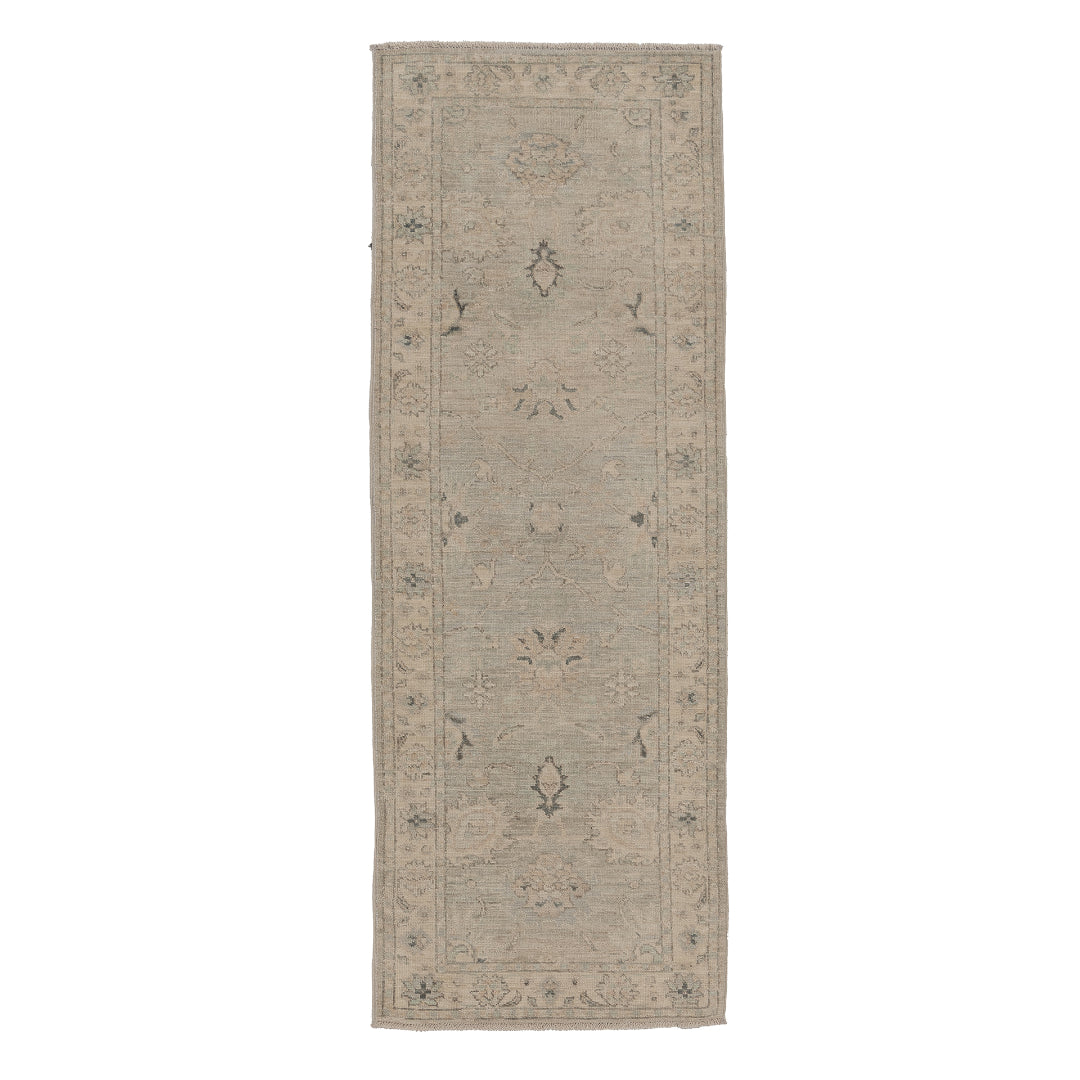 Faded light blue 2.5x10 Oushak runner rug with cream floral rosettes, delicate charcoal accents, and a wide cream border.