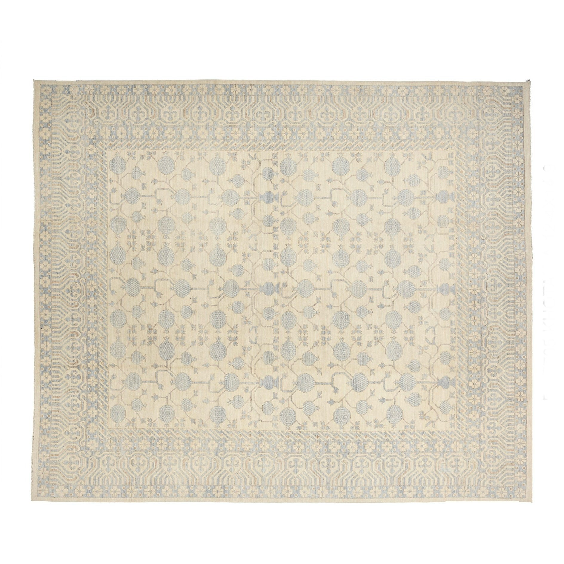 Luminous cream 12x15 Khotan area rug with periwinkle blue pomegranate lattice and geometric borders.