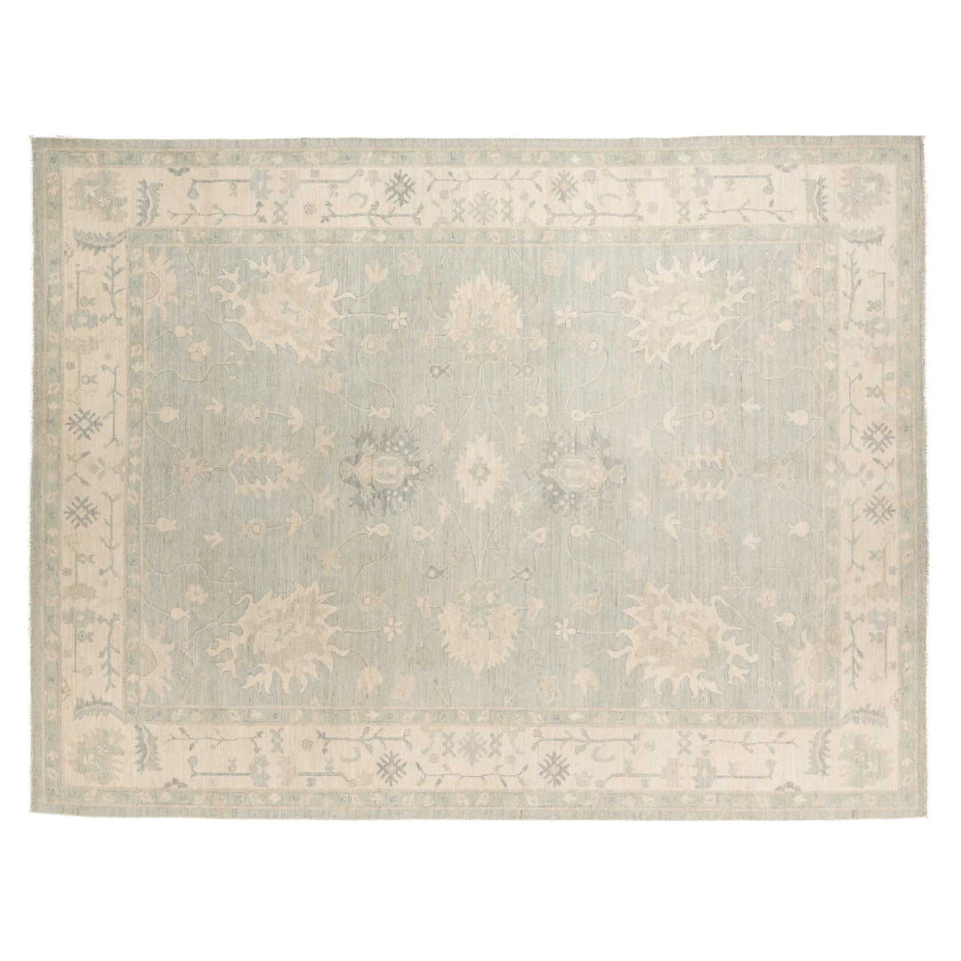 Light blue 9x12 Oushak area rug with pale green undertones, cream star medallions, and an ivory border.