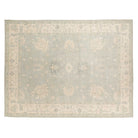 Light blue 9x12 Oushak area rug with pale green undertones, cream star medallions, and an ivory border.
