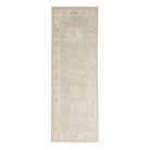 Soft light blue traditional Oushak runner rug with a muted beige and ivory floral border and distressed low pile finish.