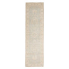 Ultra-faded light blue 2.5x10 Oushak runner rug with ivory floral medallions and a cream border.