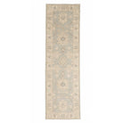 Soft light blue 2.5x10 Oushak runner rug with ivory lotus medallions, light grey accents, and a wide ivory border.