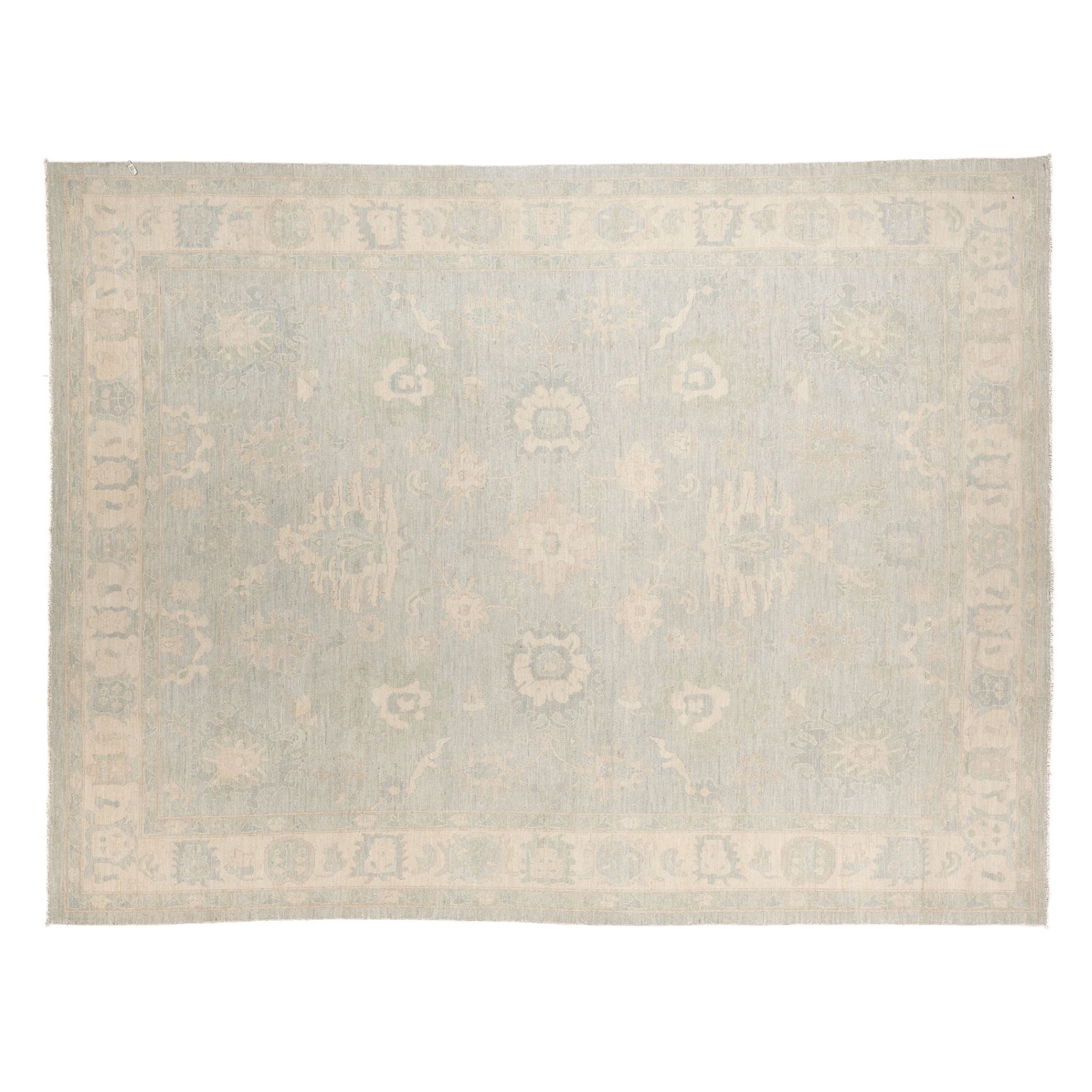 Soft seamist green 9x12 Oushak area rug with cream floral medallions and a wide cream border.