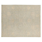 Muted celadon green 8x10 Oushak area rug with cream and taupe floral medallions.