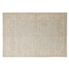 Faded soft blue green 5x7 Oushak area rug with delicate ivory motifs and a warm beige border.