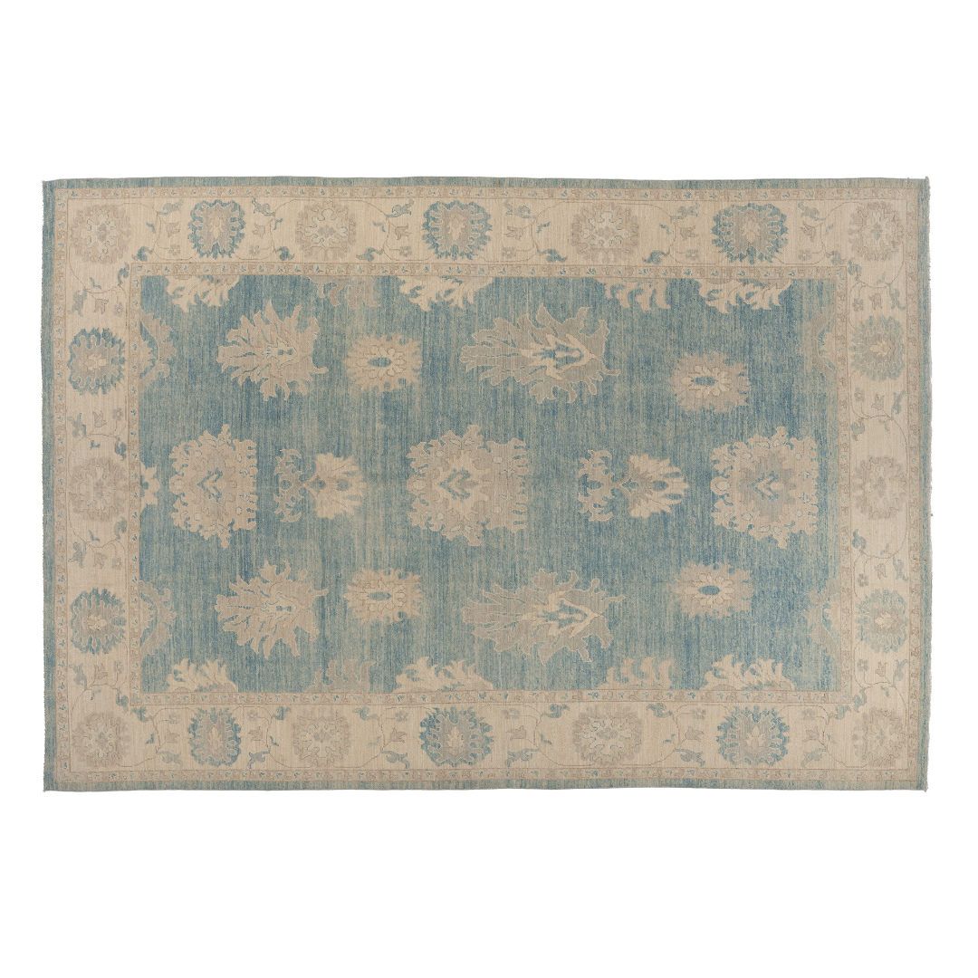 Medium blue 10x14 Oushak area rug with strié texture, beige floral palmettes, and warm camel accents.