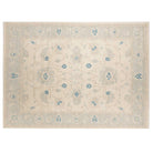 Hand-knotted 9x12 Oushak area rug with a bright cream center field, soft ice blue border, and medium blue details.