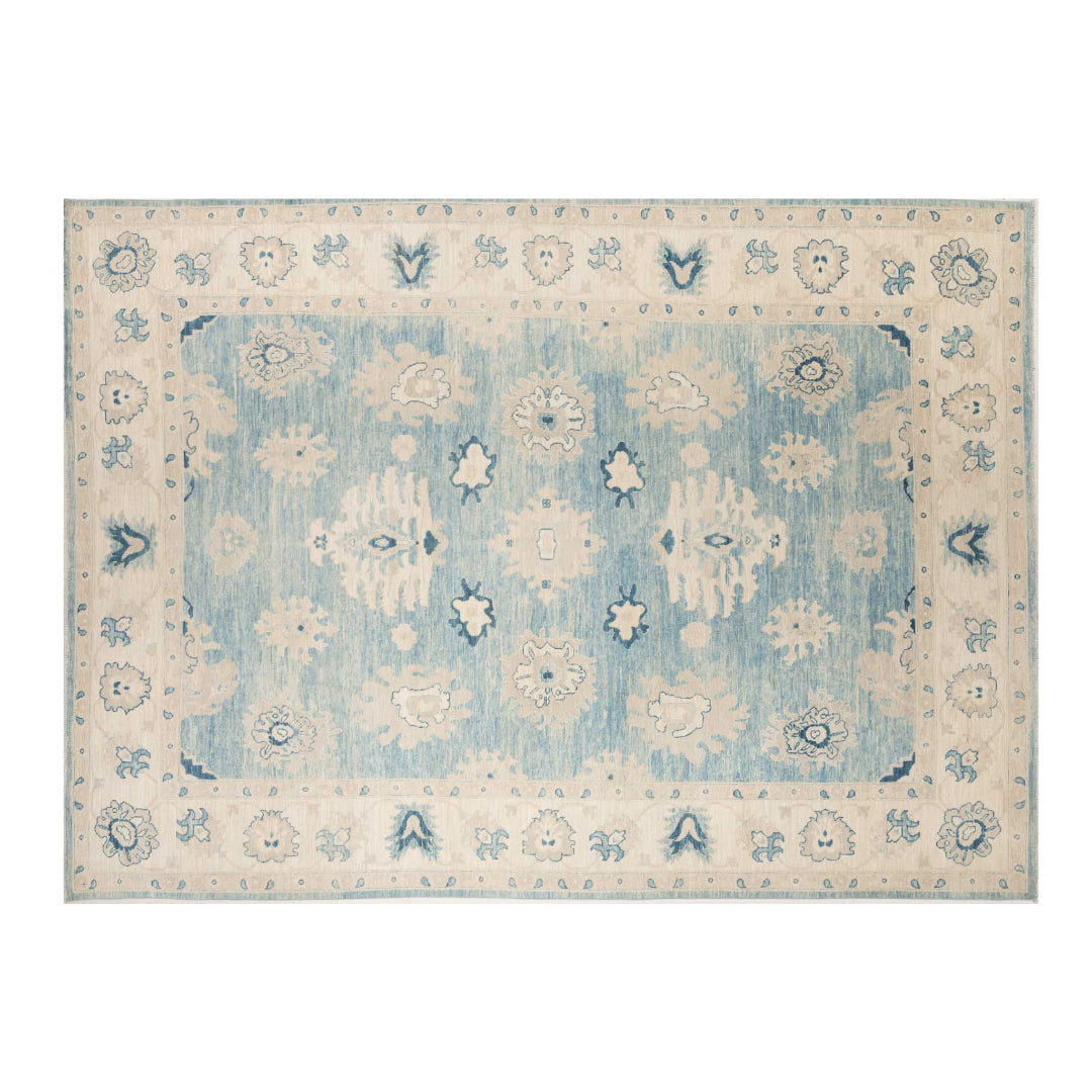 Denim blue 10x14 Oushak area rug with strié texture, ivory floral medallions, and navy accents.