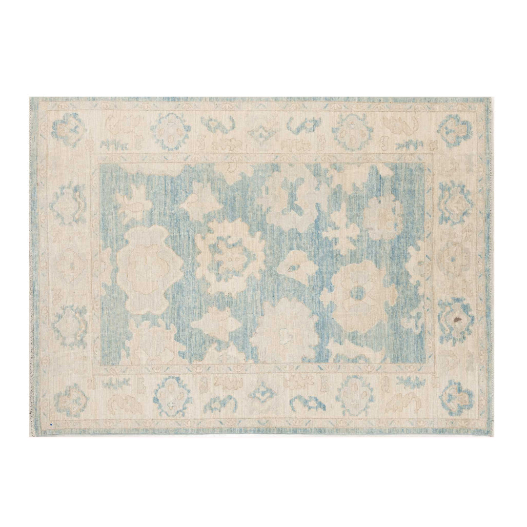 Medium blue 5x7 Oushak area rug with strié texture, beige floral palmettes, and camel accents.