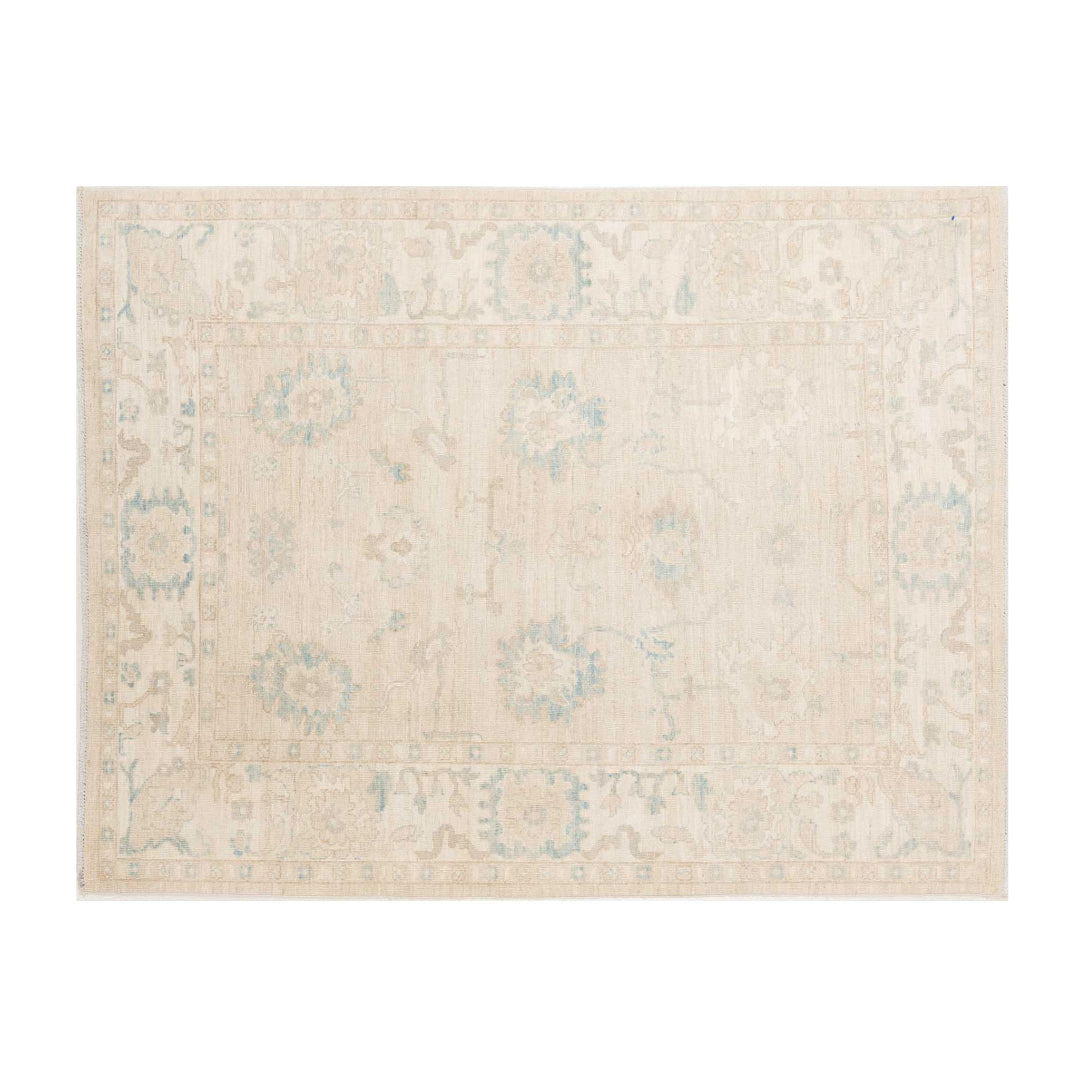 Ultra-faded french vanilla 4x6 Oushak area rug with delicate sky blue floral cartouches and a soft cream border.