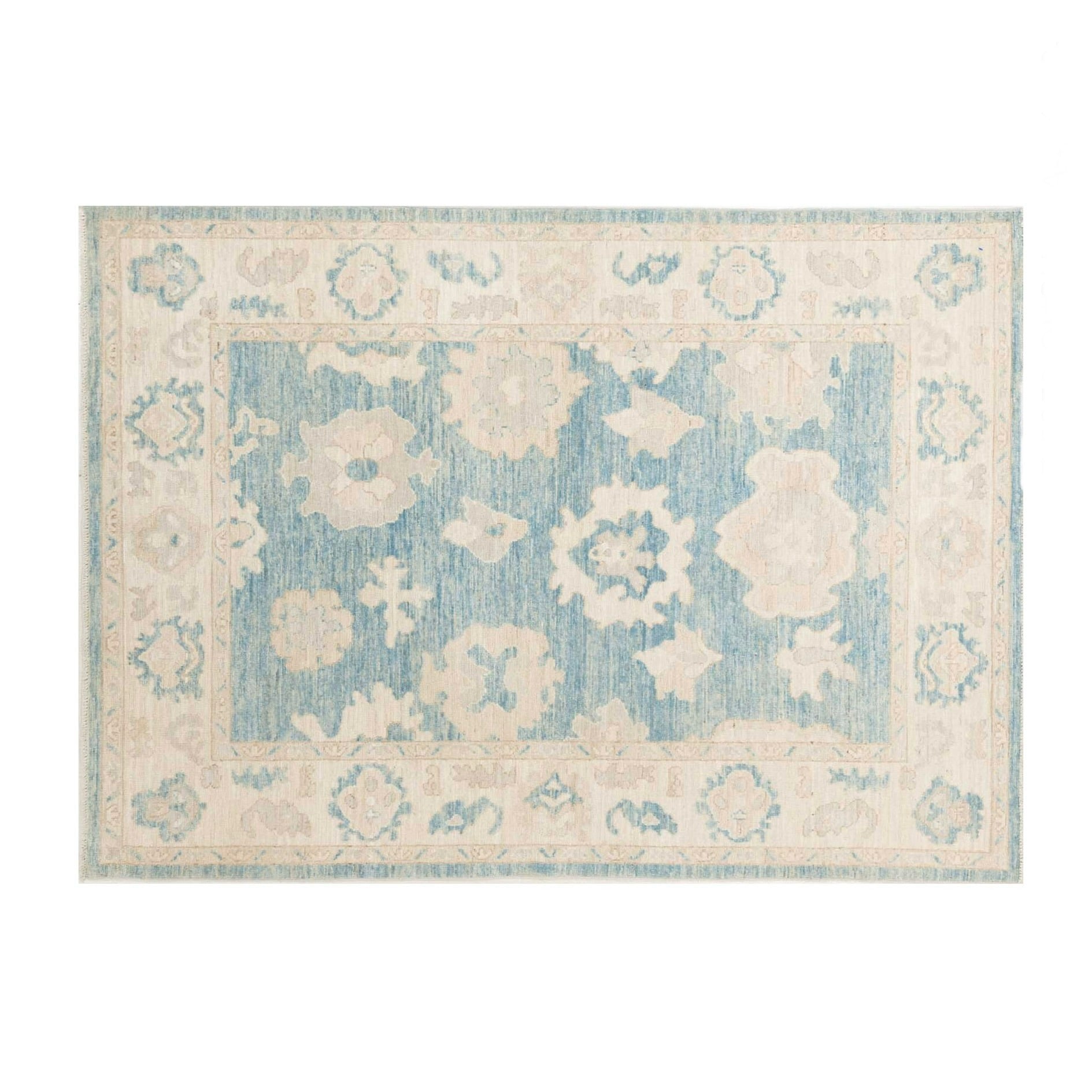 Traditional light blue 5x7 Oushak area rug with creamy ivory floral medallions and a wide cream border.