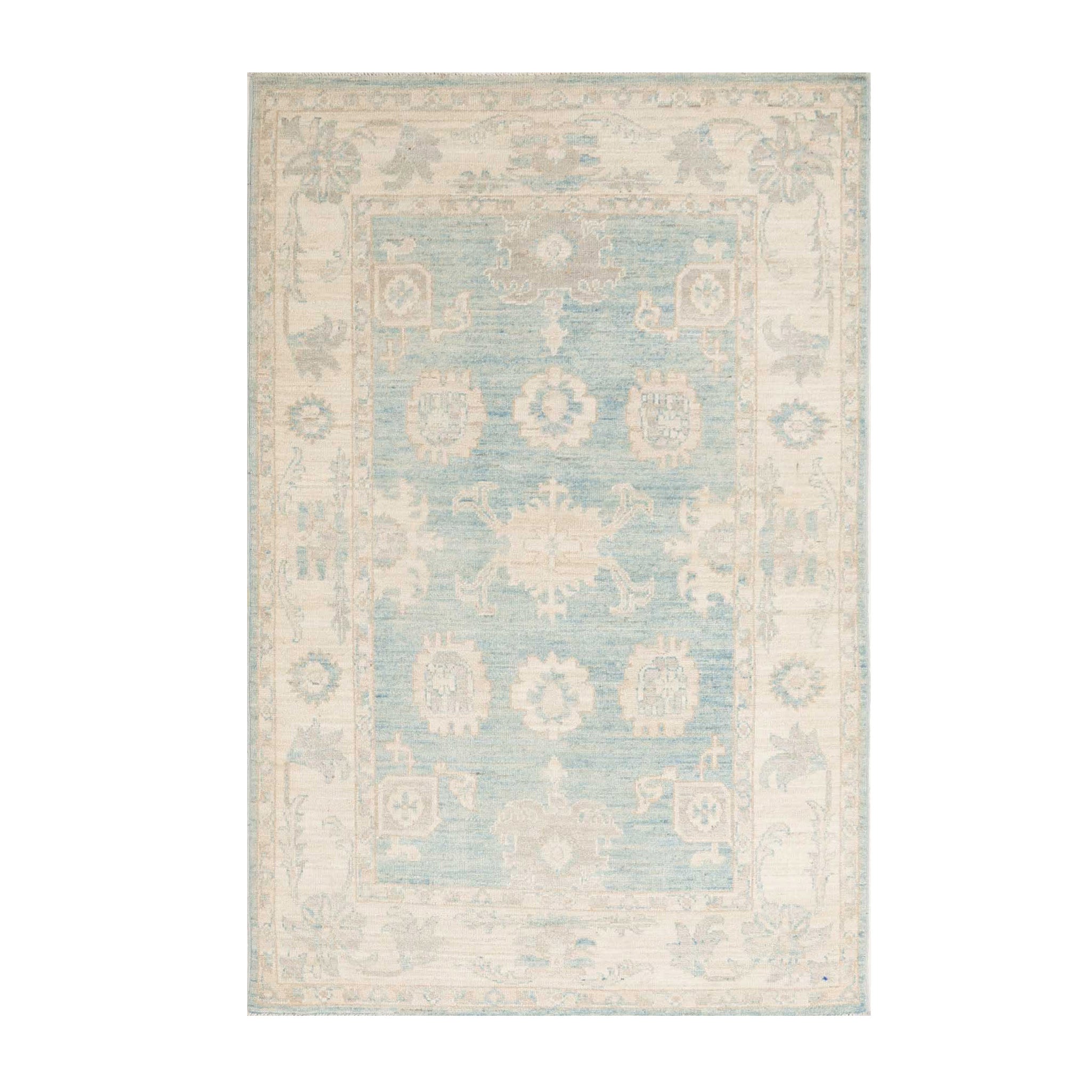 Muted medium blue 4x6 Oushak area rug with warm ivory geometric medallions, botanical details, and a distressed finish.