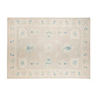 Muted greige 10x13 Oushak area rug with cream star medallions and teal blue accents.