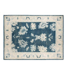 Deep navy blue 10x13 Oushak area rug with cream floral palmettes and a wide cream border.