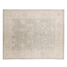 Soft light grey 8x10 Oushak area rug with cream floral medallions and a broad cream border.