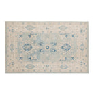 Weathered light blue 4x6 Oushak area rug with large ivory and sand-beige floral medallions, dark blue accents, and a cream border.