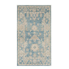 Vibrant medium blue 3x5 Oushak area rug with warm beige geometric star medallions and a distressed floral border.
