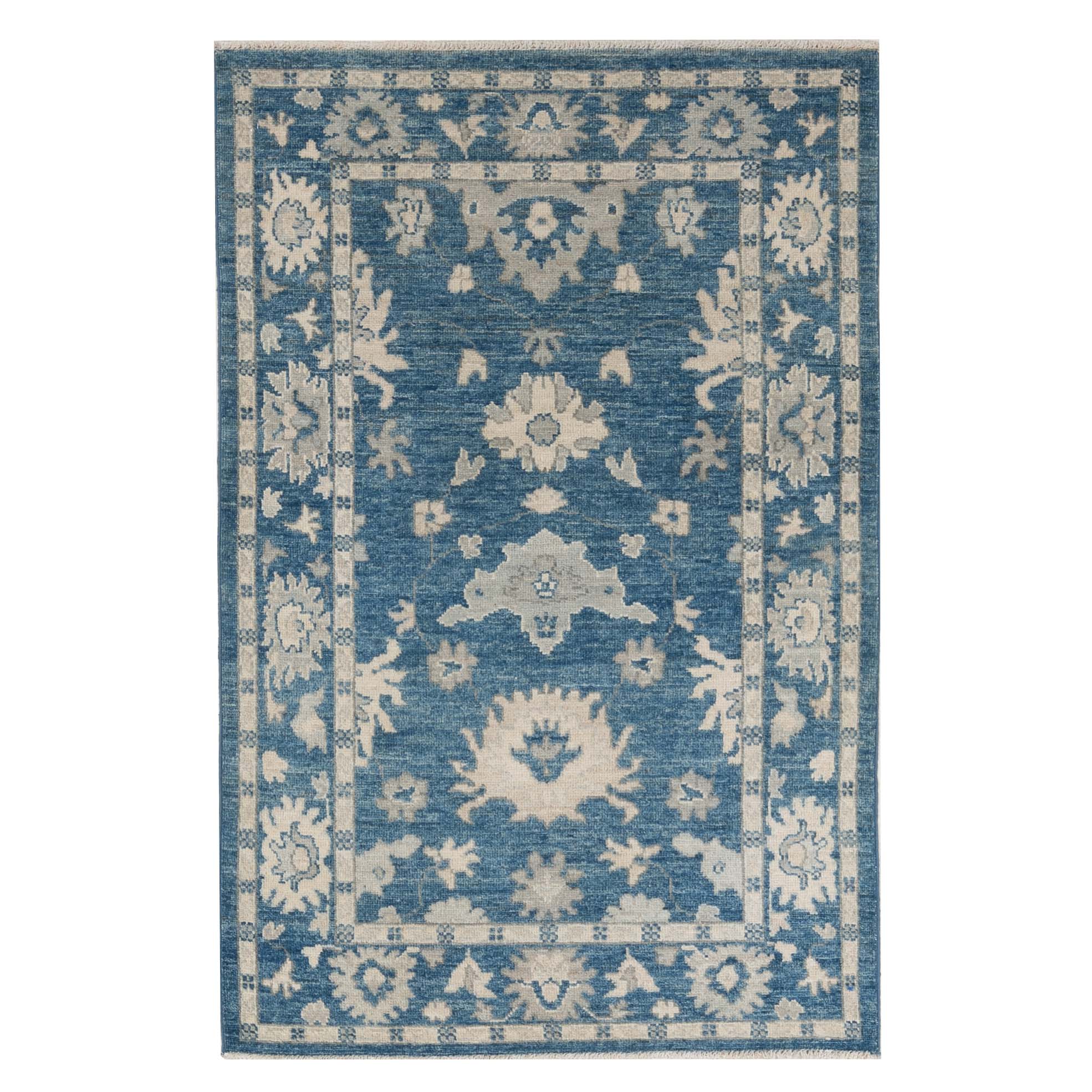 Traditional dark blue 3x5 Oushak area rug with soft ivory and beige geometric medallions and a distressed finish.