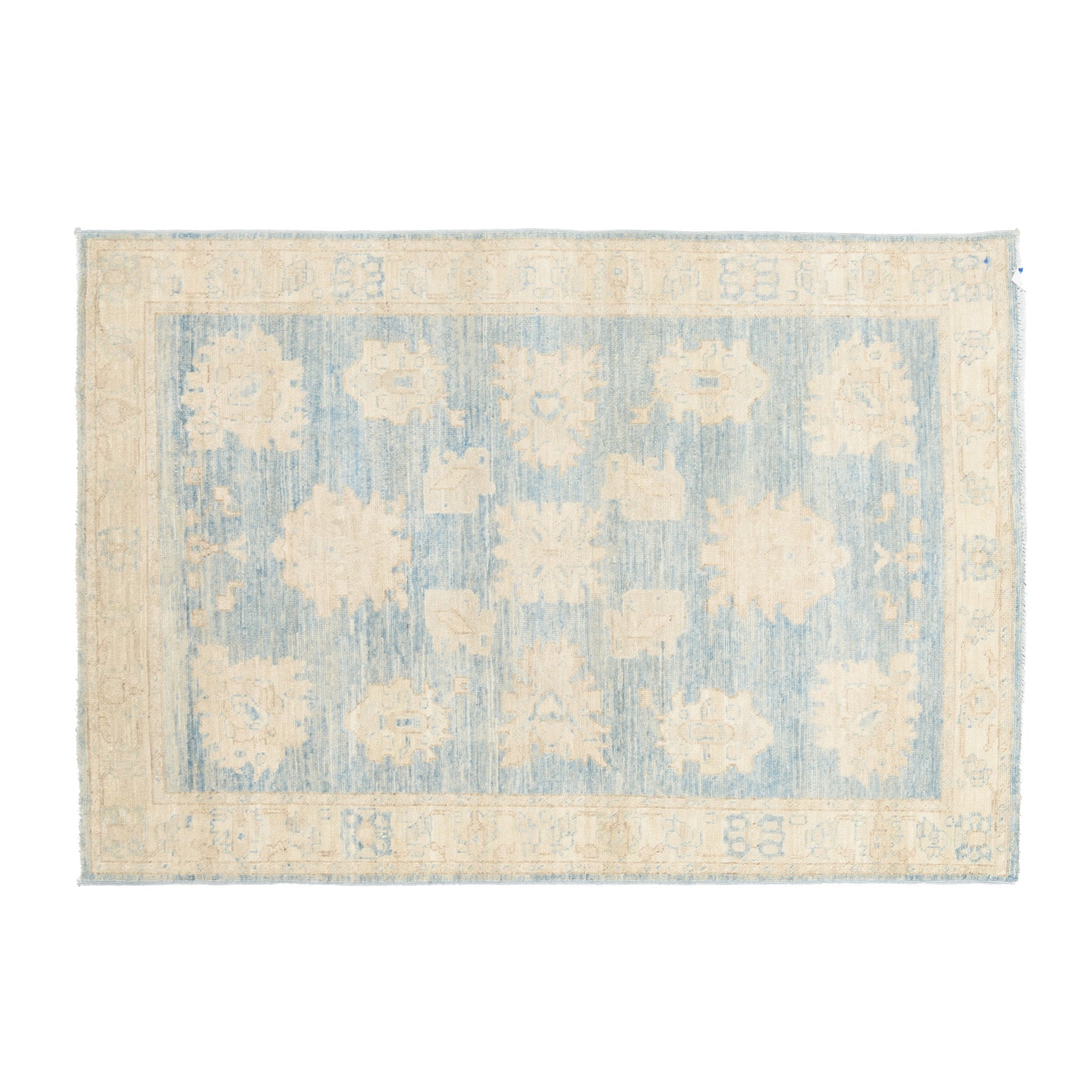 Traditional medium blue 4x6 Oushak area rug with warm beige and cream geometric medallions and a distressed cream border.
