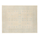 Ultra-faded ivory 9x12 Khotan area rug with delicate light blue geometric motifs and soft abrash texture.