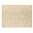 Tone-on-tone oatmeal 10x14 Oushak area rug with warm cream floral motifs and soft greige details.