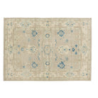 Muted deep taupe 5x7 Oushak area rug with cream floral medallions and dark blue accents.