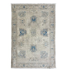 Traditional ivory 3x5 Oushak area rug with muted light blue and prominent dark blue geometric floral motifs.