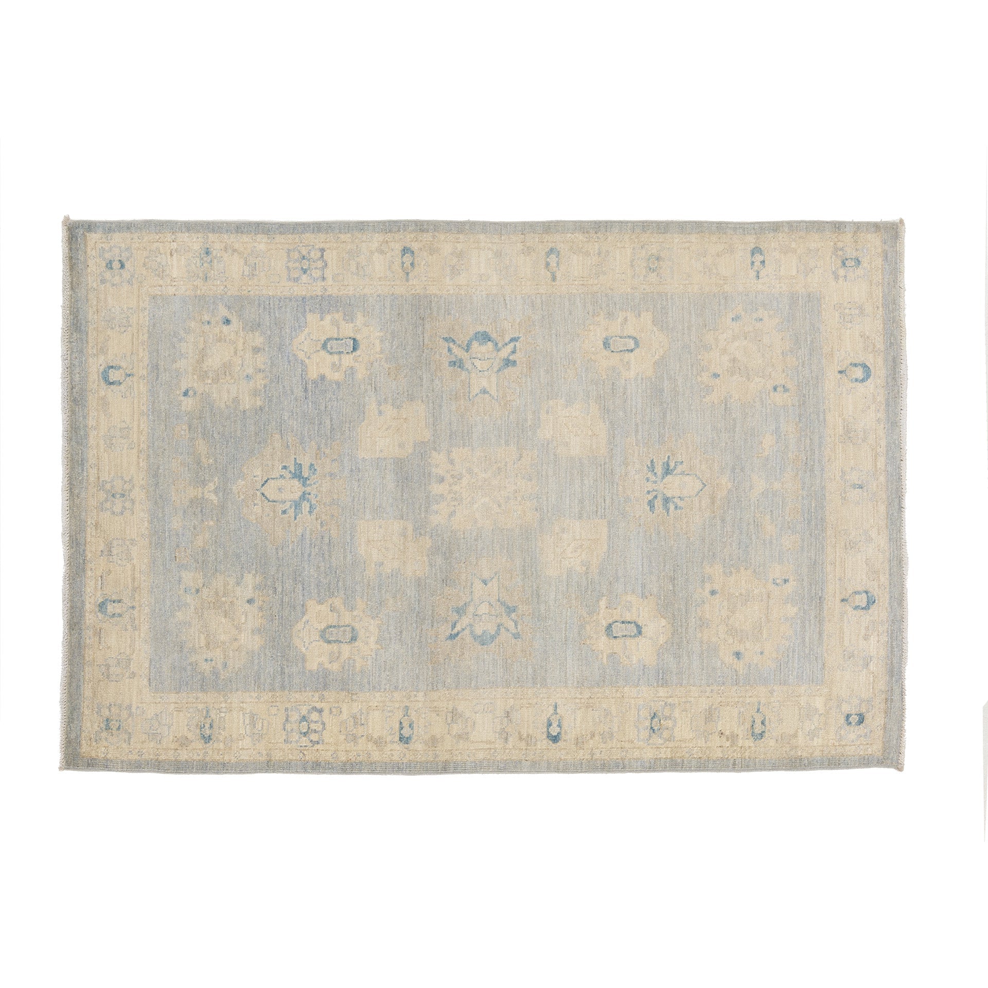 Traditional greyish blue 4x6 Oushak area rug with muted beige and ivory floral medallions, medium blue accents, and a distressed cream border.