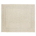 Ultra-faded cream 8x10 Khotan area rug with pale blue tree-of-life motifs and a geometric multi-tiered border.