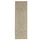 Soft light blue and ivory traditional Oushak runner rug with a heavily distressed, muted medallion pattern and low pile finish.